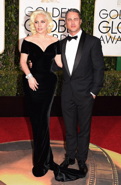 Lady Gaga embodies retro Hollywood glamour with her handsome fiance Taylor Kinney. Both are dressed in Atelier Versace. Image: Versace via Instagram