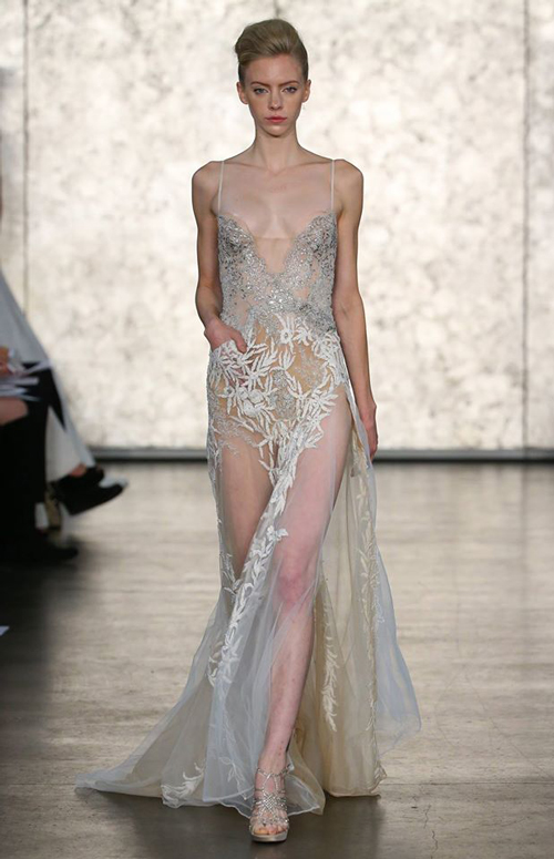 A see-through ethereal dress with silver tones and foliage-inspired embroidery. Image: Inbal Dror via Facebook