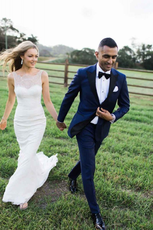 This gorgeous bride brought a pair of thongs to change into so she could walk on muddy terrain for her wedding photos.